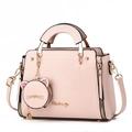 Detail of light pink handbag with gold brand logo and cute glittery cat charm accessory - 25*10*19 / Pink