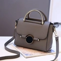 Elegant grey litchi grain leather handbag with gold round buckle and metallic curved handle - Dark Gray
