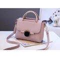 Elegant lavender faux leather crossbody bag with a round buckle and golden metal handle - Light Purple