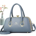 Detailed macro view of high quality matte leather and gold hardware on blue handbag - 29*14*16 / Blue