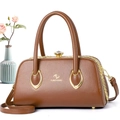 Detail of dark brown lychee leather handbag with golden diamond twist lock and dual handles - 29*14*16 / Earthy Yellow