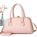 Detailed close-up of pink leather handbag with gold chain and TUBOYANG logo - 29*14*16 / Light Pink