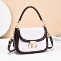 Retro contrast shoulder bag with white woven flap and brown leather finish in studio setting - Coffee/White