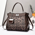 Leopard print handbag with brown patent leather trim and silver clasp lock charm - Coffee