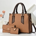 Detail view of a 3-piece brown woven handbag set with matching tote, clutch, and pouch - 27x13x22cm / Earthy Yellow