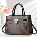 Brown crocodile embossed handbag with golden padlock and black leather top handles - Coffee