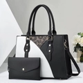 Close-up of black and white color-block tote set with matching envelope clutch and strap - Black