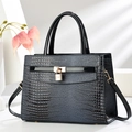 Elegant black crocodile texture handbag with gold hardware and adjustable crossbody strap - Blue