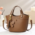 Detail of brown litchi pattern bucket bag with golden hardware and flower pendant - 20*12*19cm / Brown