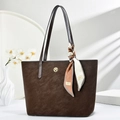 Deep brown matte leather tote bag with printed silk scarf and golden logo detail - Coffee