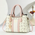 Fashionable cream white and pink tote bag with gold hardware and leaf charm pendant - Pink