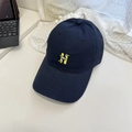 Navy blue baseball cap with yellow H embroidery and cartoon detail on white table - 56-60cm (Adjustable) / Navy Blue