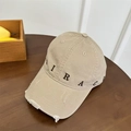 Berretto da baseball kaki in stile vintage con ricamo Miracle su tavolo in legno - Taglia unica / Cachi