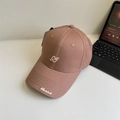 Dusty pink baseball cap with N embroidery and Newclub detail on a white table - 56-60cm Adjustable / Lotus Pink