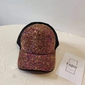 Detailed close-up of a black trucker hat featuring shimmering rose gold rhinestones - Adjustable / Colorful