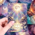 Close-up of inspirational card showing Believe in Miracles text with mystical purple art - Healing Illustration (RXHA0025) / 18 Sheets