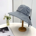 Detail of grey striped wide-brim sun hat featuring a knit band and bow decoration - 55-59CM / Gray Blue