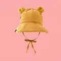 Detail of yellow corduroy baby winter hat with plush bear ears and chin straps - 55-58cm / Yellow