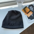 Detail of dark grey knit beanie featuring 3D LUCK lettering and premium wool texture - 55-60cm / Dark Gray