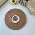 Close-up of caramel brown knitted beret featuring a vintage letter P embroidery patch - One Size / Camel