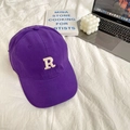 Close-up of deep purple cotton baseball cap with white R embroidery on soft white bedding - 55-59cm (Adjustable) / Purple