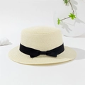 Close-up of beige boater straw hat featuring a black ribbon bow against minimalist decor - 55-59CM / Off White