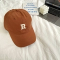 Detailed embroidery of white letter R on a rust brown cotton baseball cap over white fabric - 55-59cm (Adjustable) / Brown