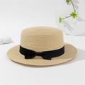 Close-up of woven boater hat featuring a black grosgrain ribbon and bow detail - 55-59CM / Beige