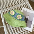 Detail of hand-crocheted green straw hat with colorful floral patterns and woven texture - One Size / Fruit Green