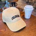 Detail of Colorado embroidery on beige cotton baseball cap over a wooden table - 55-59cm (Adjustable) / Beige Khaki
