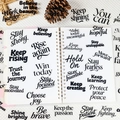 Detailed view of clear PET inspirational quote stickers on a white spiral notebook - 56 Sheets Inspirational Quotes Set (T01043129)