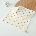 Soft cream cotton gauze baby towel featuring a brown heart print and natural texture - Heart