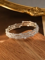 Close-up of triple-layered silver bracelet with pave-set white zircons on wooden base - Silver (Square Rhinestone)
