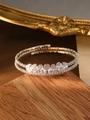 Silver layered bangle featuring seven oval cubic zirconia stones and pavé set crystals - Silver (Oval Zirconia)
