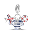 Macro detail of nautical silver charm with airplane, striped shirt and lifebuoy elements - Nautical Plane Navy Shirt Lifebuoy Style