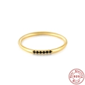 Minimalist S925 sterling silver ring in gold finish featuring elegant black micro-pavé stones - US 7 / Gold