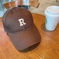 Dark brown baseball cap with white embroidered R letter on a wooden surface - 60-65cm Adjustable / Coffee