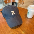 Navy blue baseball cap with white 3D letter R embroidery on wooden cafe table - 60-65cm Adjustable / Navy Blue