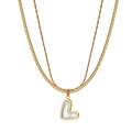 Detail of double-layer gold chain necklace with a white heart pendant and snake chain - Double Heart Shell Pendant Necklace (STMN08) / Gold