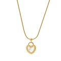 Detailed macro of gold heart pendant with white mother of pearl inlay on snake chain - Twisted Edge Heart Shell Pendant Chain (STMN07) / Gold