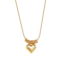 Detailed macro view of 18k gold snake chain with hollow heart pendant and polished finish - Hollow Heart Snake Chain Pendant (STKN09) / Gold