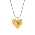 Detail of 18k gold heart pendant with irregular lava texture on snake chain - Irregular Texture Heart Pendant (STGN01) / Gold