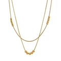 Detail of gold double-layered snake chain necklace with polished beads on white background - Double Layer Snake Chain Beads (STCC04) / Gold