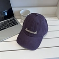 Deep purple corduroy baseball cap with embroidered Network text in lifestyle setting - 56-58cm Adjustable / Purple