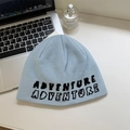 Light blue knit beanie with black Adventure jacquard text and a warm winter texture - 56-58cm / Blue