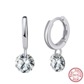 Macro shot of S925 sterling silver hoop earrings with brilliant-cut round zircon drops - Platinum