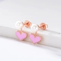 Macro shot of S925 sterling silver stamp on heart pearl earrings with pink enamel detail - 925 Silver / Pink