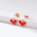 Close-up of S925 sterling silver heart earrings with white pearls and red enamel - 925 Silver / Red