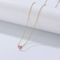 Detail of pink enamel heart pendant with sparkling white stone on a delicate gold chain - 925 Silver / Dark Pink