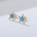 Macro detail of blue enamel star stud earrings with micro-set cubic zirconia accents - 925 Silver / Turquoise